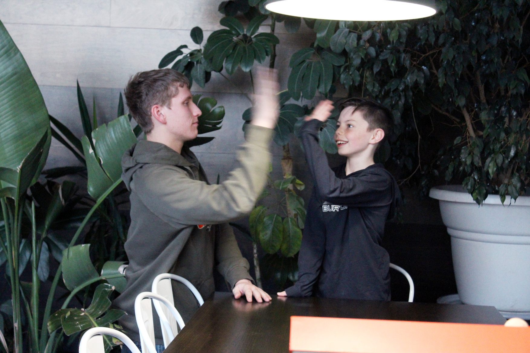 Terran Bursch and Cullen high-five each other
