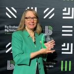 BBBS of Central Minnesota Director Jackie Johnson poses with the Biggie Award