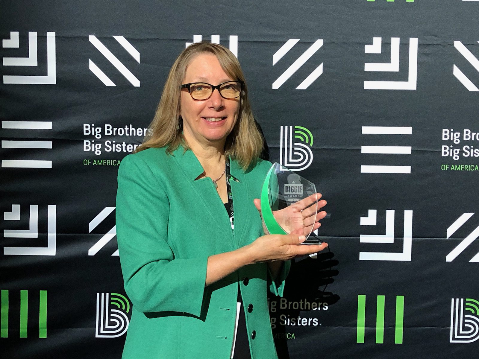 BBBS of Central Minnesota Director Jackie Johnson poses with the Biggie Award